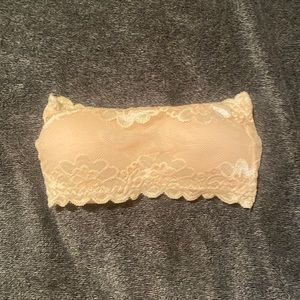 Nude strapless bra with floral print.